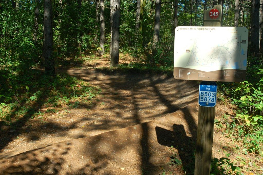 sign and trail in singletrack park at lebanon hills