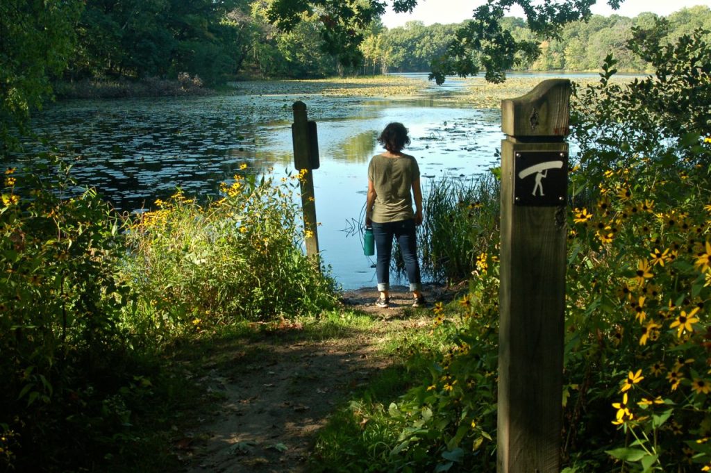 woman standing at canoe portage