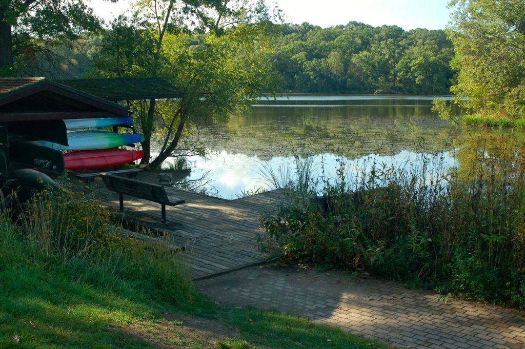 canoes and kayaks ready for rental next to Schulze Lake