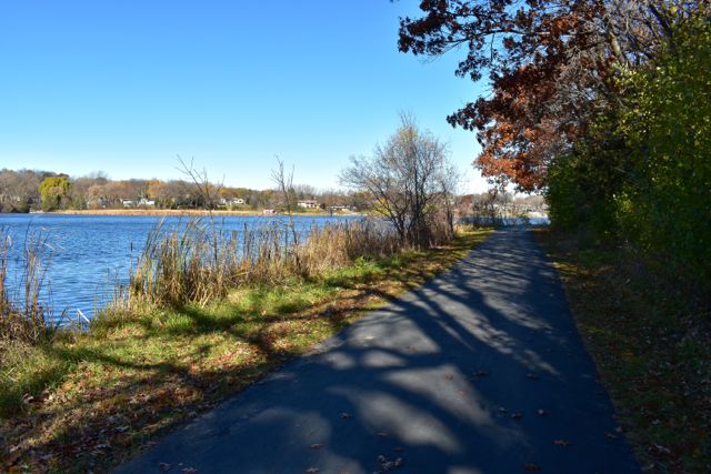 paved trail alongside a lake