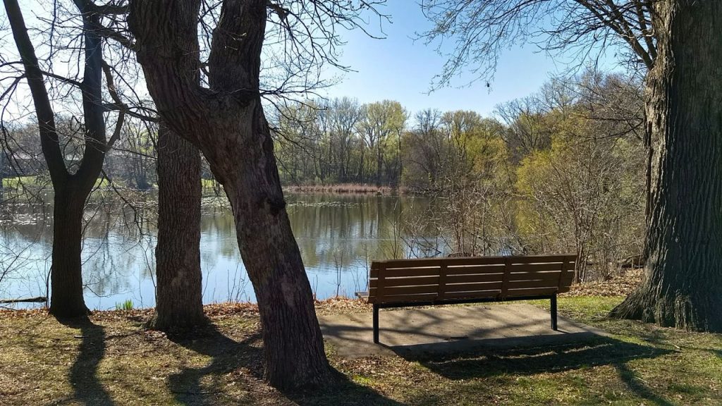park bench next to highland lake