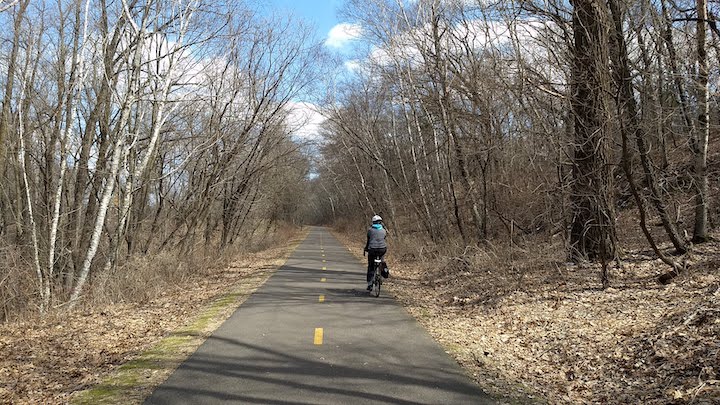 biker on brown creek trail in the early spring