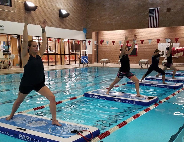 SUP fitness at the YMCA, students on SUPs in the pool