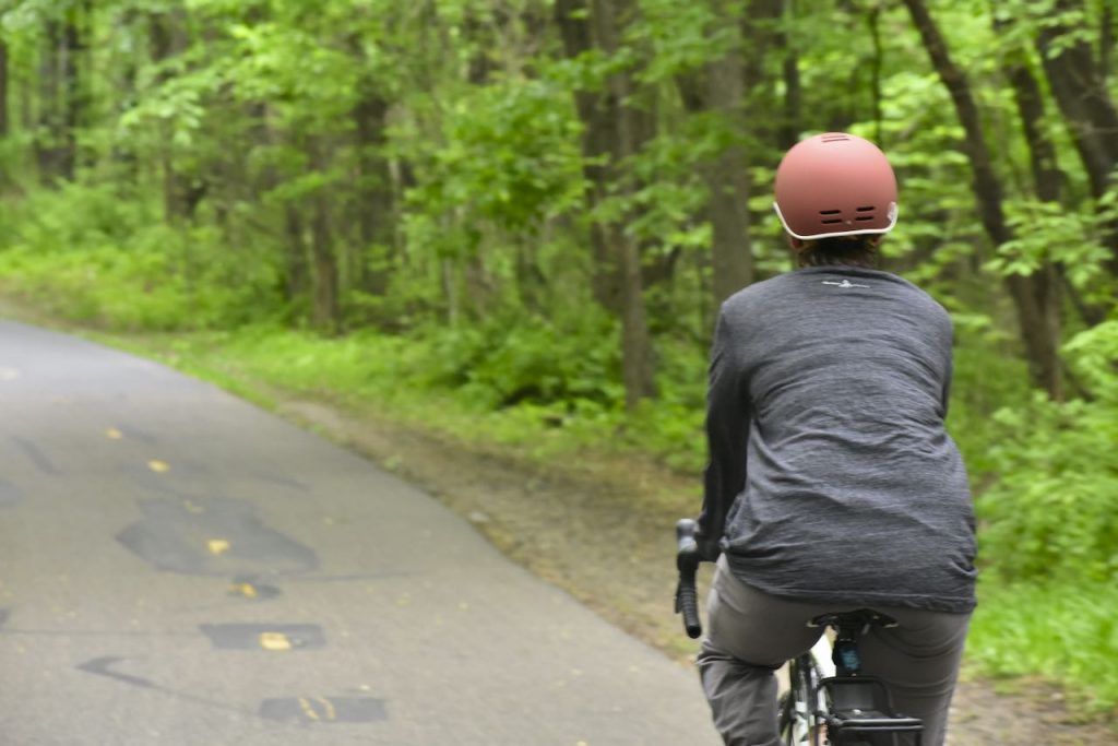 biker on a paved trail in elm creek park reserve
