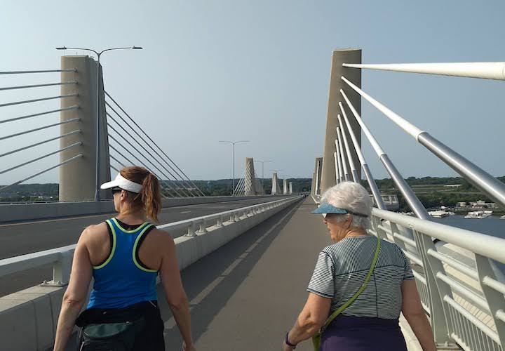 two women hiking the hwy 36 bridge over the st croix river