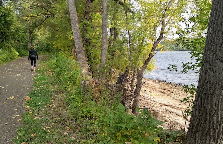 woman hiking along the st croix river