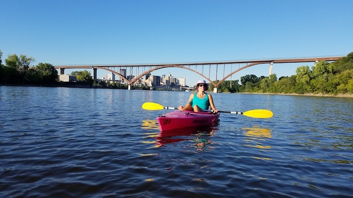 Molly, guide with Twin Cities Kayaking, on the Mississippi River in her kayak