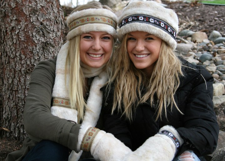 two women model polar mitts mittens, hats and scarf