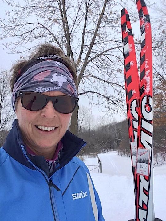 Natalie Griffith, owner of over the hill outdoors, with her cross country skis