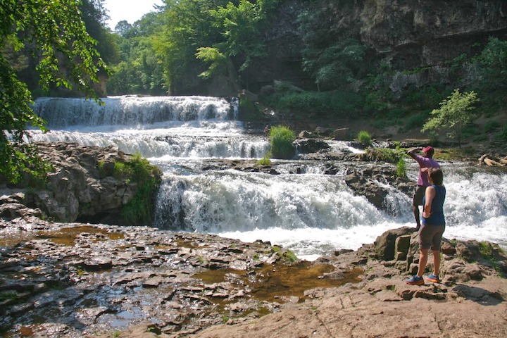 two people observe Willow Falls, Willow River State Park