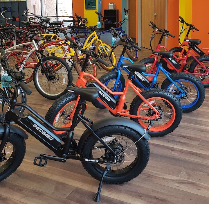 many colorful electric rental bikes at Pedego Stillwater