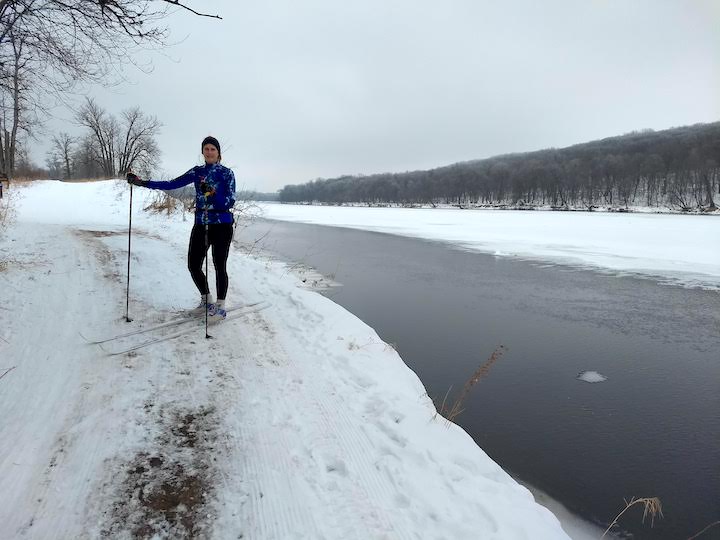 cross country skier next to river