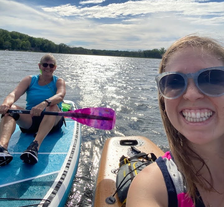 a selfie of two women on their paddleboards on Snail Lake