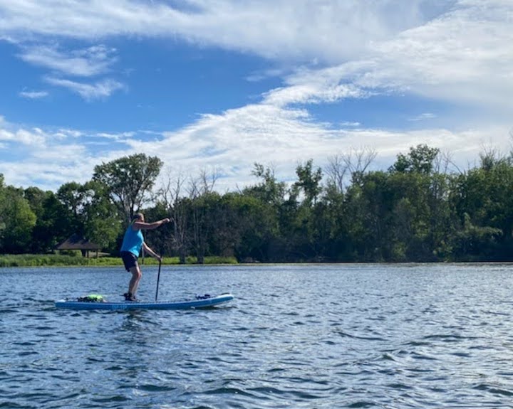 woman on a stand-up paddle board on Snail Lake, paddling