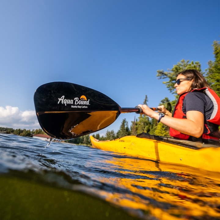 woman kayaking with Aqua Bound Manta Ray Carbon paddle