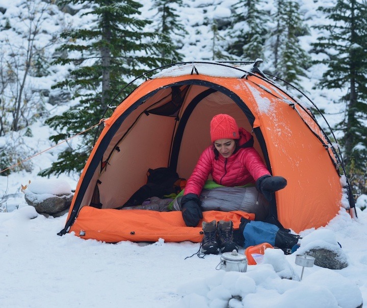 woman in a tent winter camping