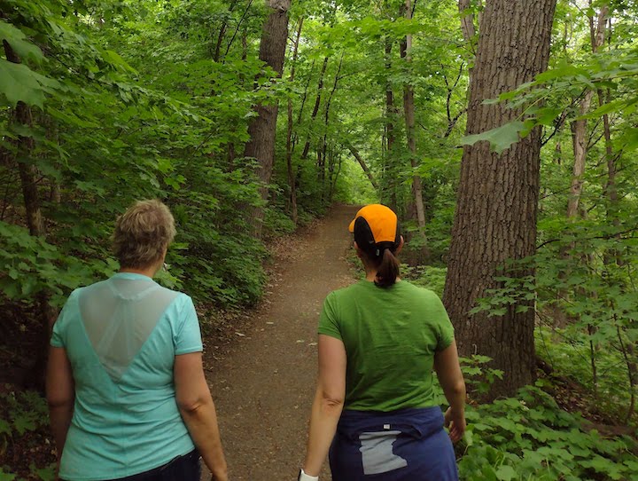 two women hike on the Winchell Trail in Mississippi Gorge Regional Park