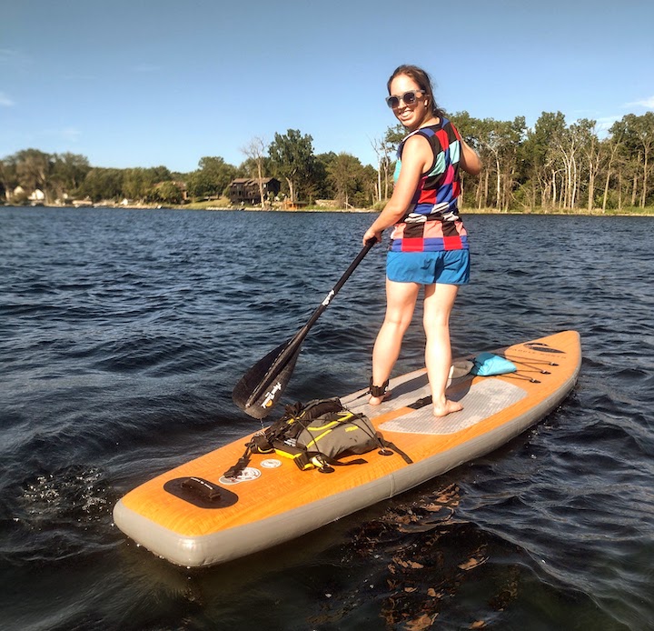 woman paddleboarding on a local lake