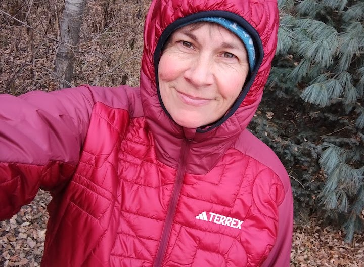 the author wearing her Terrex Xperior jacket from adidas, shows the hood